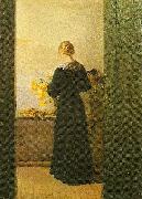 Anna Ancher en ung pige ordner blomster oil